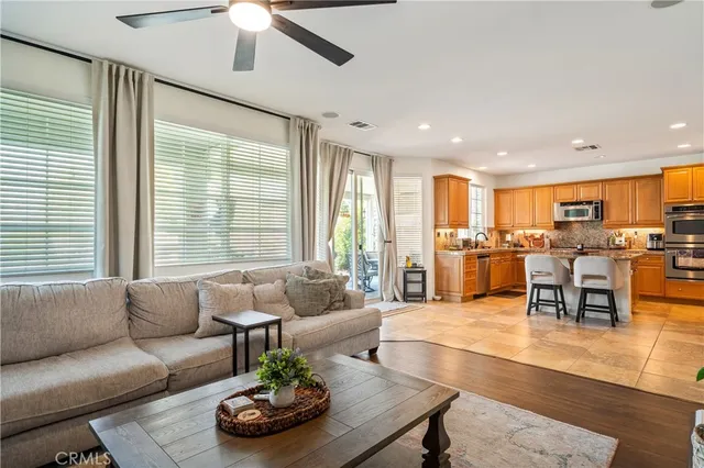 a living room with dining table and chairs