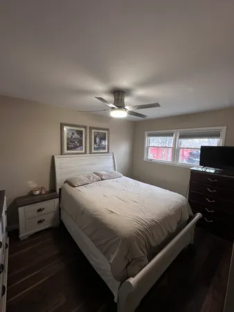 a bedroom with a bed and a closet