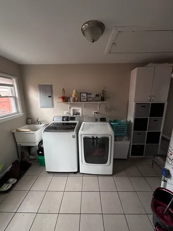 a kitchen with a sink a stove and a microwave