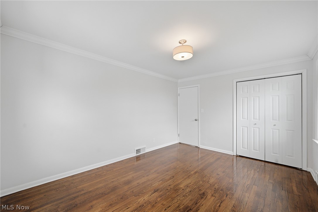 3722 Lindholm Road Shaker Heights, OH 44120 - Photo 22 of 34 The room features hardwood floors, white walls, and a ceiling light fixture