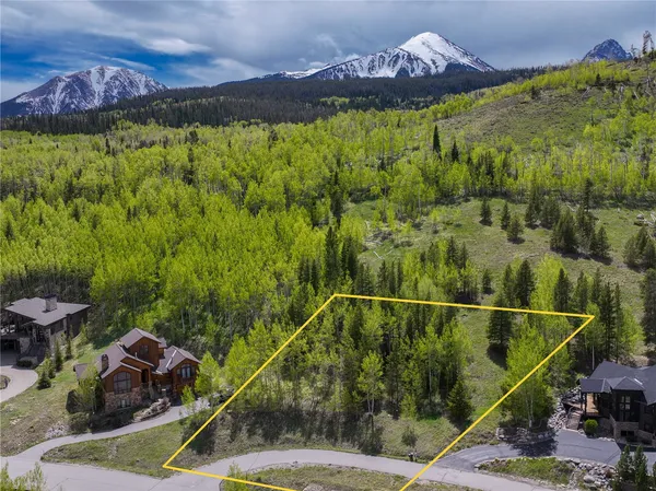 a view of a swimming pool with a yard and mountain view