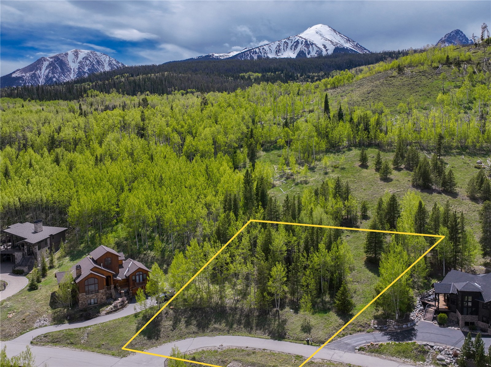a view of a swimming pool with a yard and mountain view