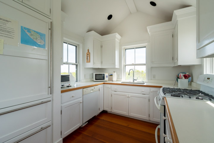 94-21 Tuckernuck Nantucket, MA 02554 - Photo 8 of 20 a kitchen with cabinets a sink and appliances