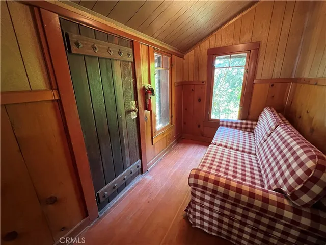 a bedroom with furniture and a window