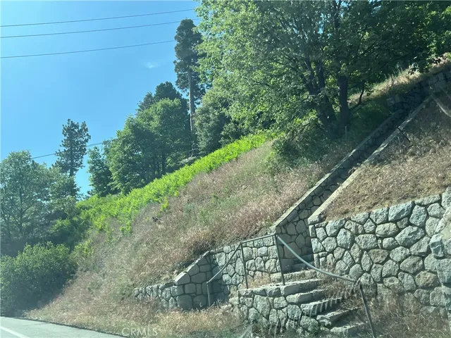 a view of a yard and mountain