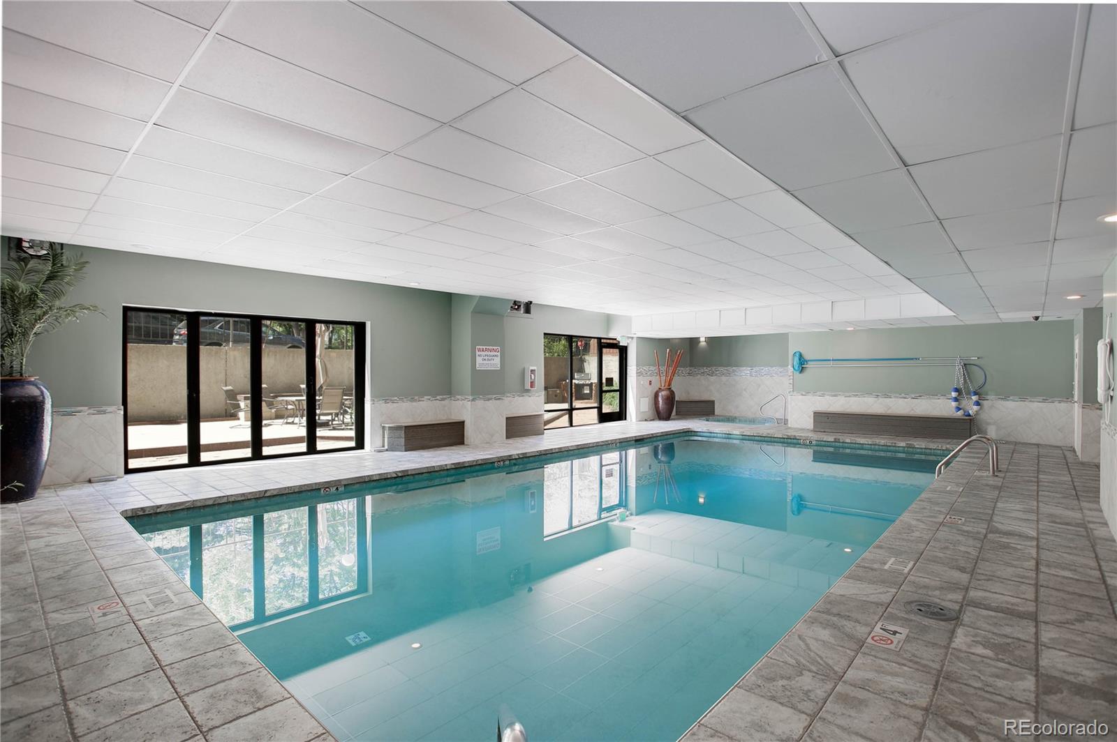 2 Adams Street, Unit 608 Denver, CO 80206 - Photo 12 of 18 a large kitchen with lots of counter space and windows