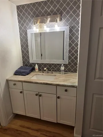 a bathroom with a sink and a mirror