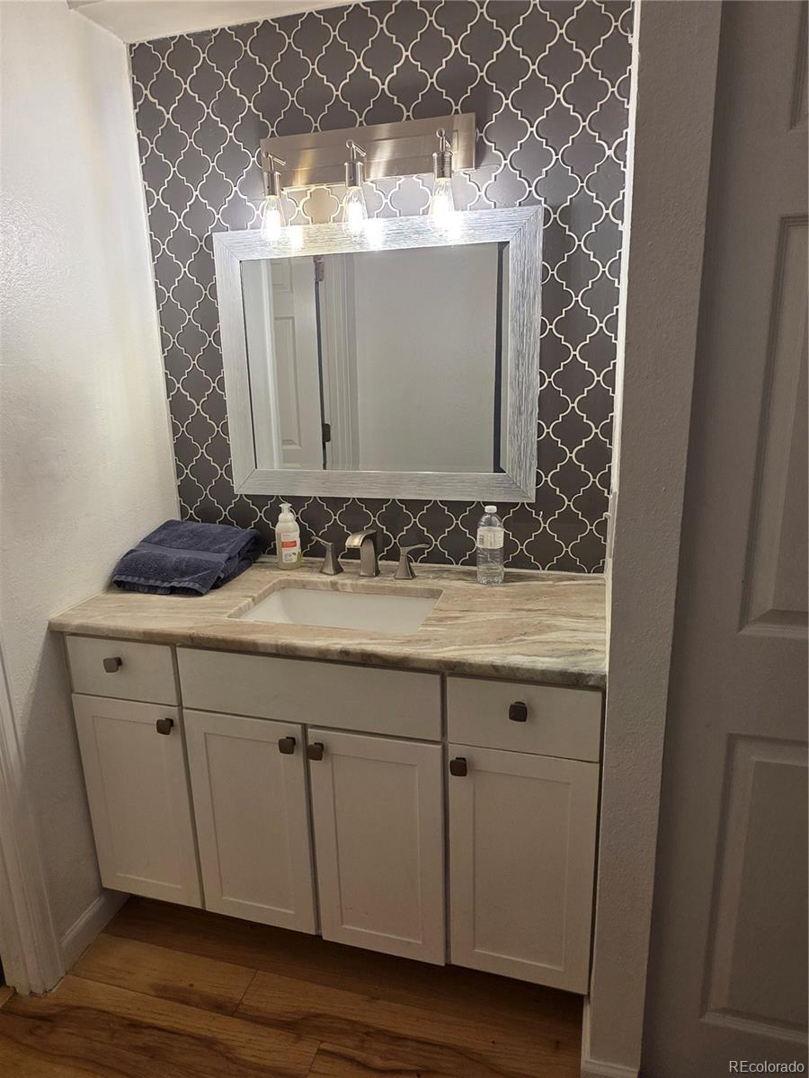 2 Adams Street, Unit 608 Denver, CO 80206 - Photo 10 of 18 a bathroom with a sink and a mirror