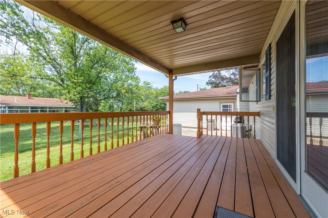 1140 West River Road Vermilion, OH 44089 - Photo 32 of 49 Deck featuring a yard