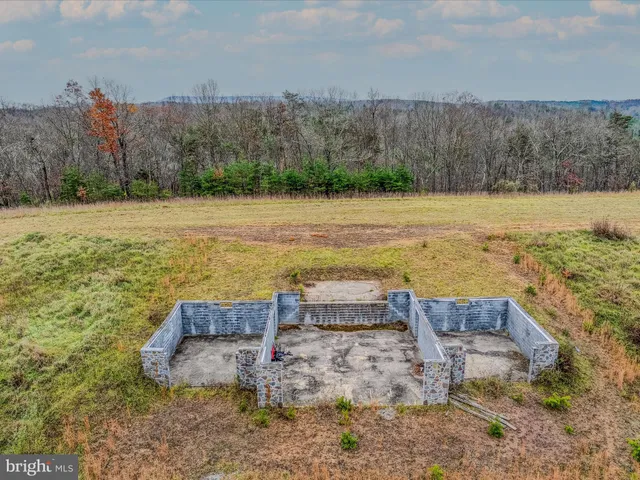 a view of a lake with trees in the background