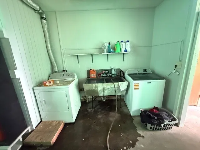 a kitchen that has a sink and a stove