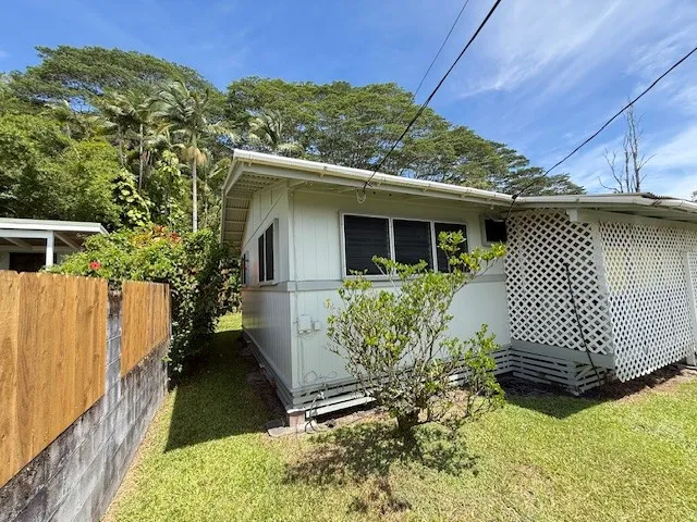 a view of a backyard with swimming pool
