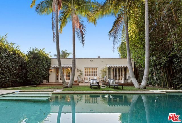 a view of swimming pool with chairs