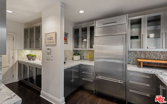 a kitchen with appliances and cabinets