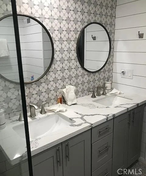 42983 Fern Avenue Big Bear Lake, CA 92315 - Photo 2 of 9 a bathroom with a sink and a mirror