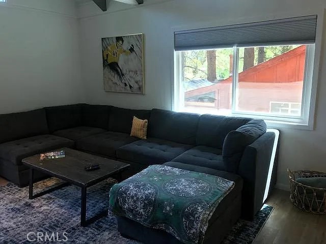 42983 Fern Avenue Big Bear Lake, CA 92315 - Photo 8 of 9 a living room with furniture and a window