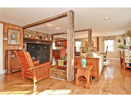79 Hollow Tree Ridge Road Darien, CT 06820 - Photo 3 of 21 a living room with furniture a flat screen tv and floor to ceiling window