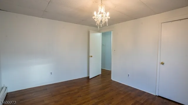 a view of a chandelier in big room and chandelier