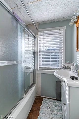 a kitchen with a sink and refrigerator