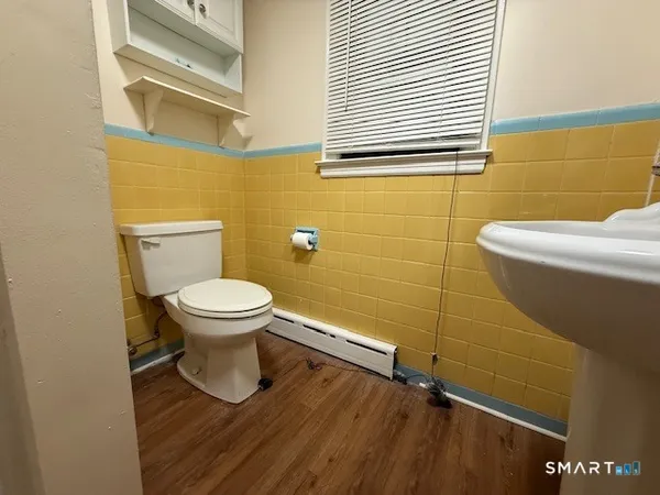 a bathroom with a toilet and a sink