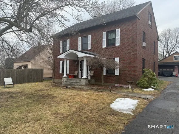 a front view of a house with yard