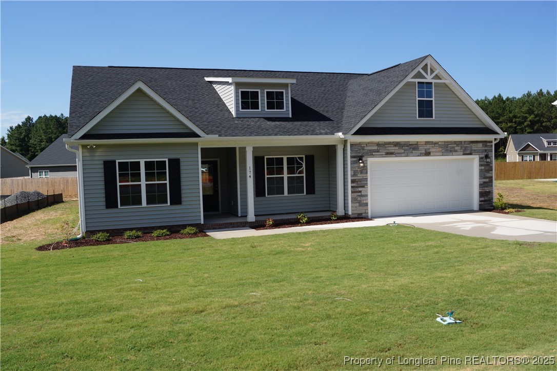 174 Nectar Lane Bunnlevel, NC 28323 - Photo 1 of 41 a front view of a house with a yard