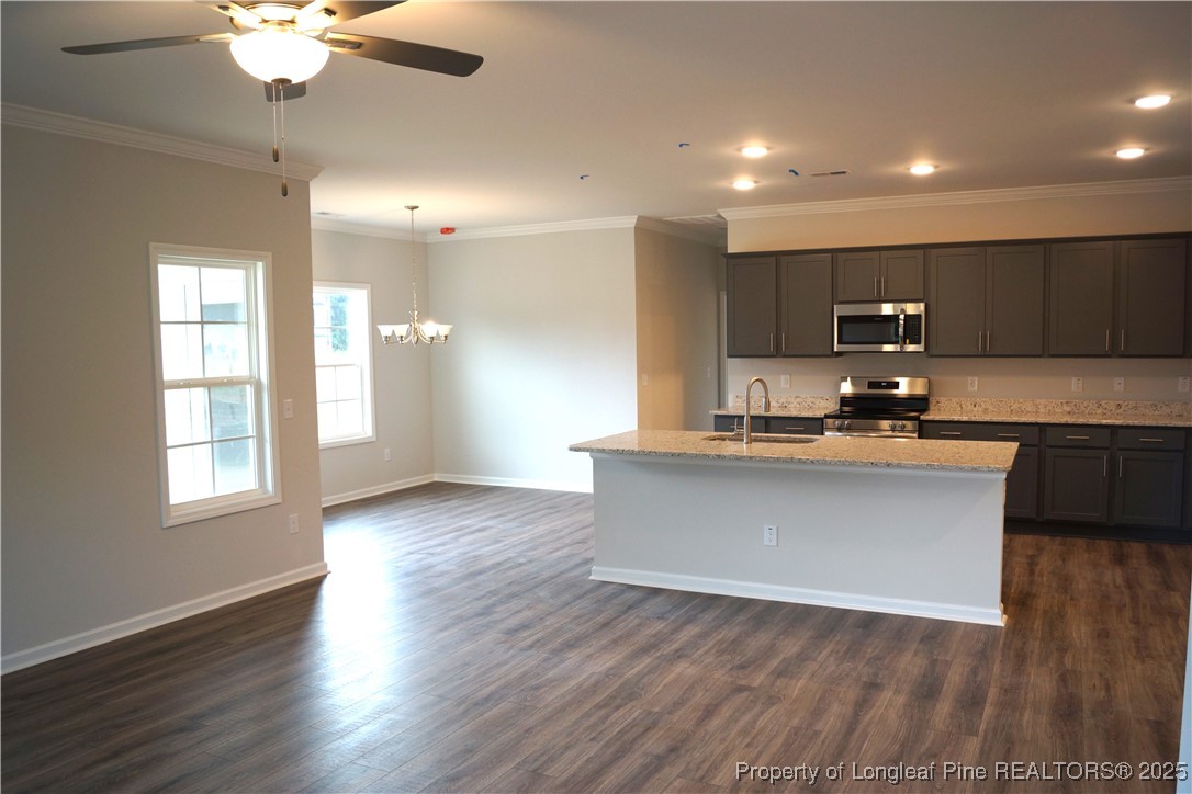 174 Nectar Lane Bunnlevel, NC 28323 - Photo 18 of 41 a view of kitchen with granite countertop sink and cabinets