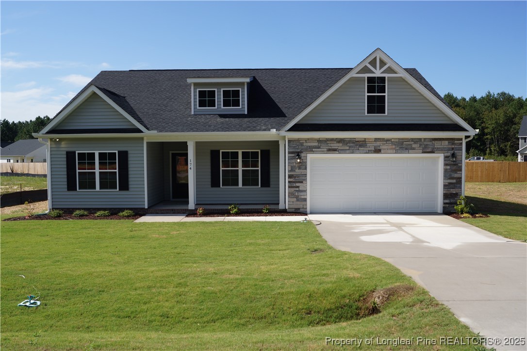174 Nectar Lane Bunnlevel, NC 28323 - Photo 2 of 41 a front view of a house with a yard