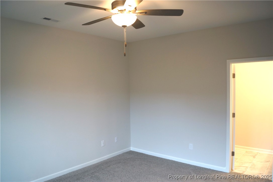 174 Nectar Lane Bunnlevel, NC 28323 - Photo 22 of 41 en empty room with a window and a fan
