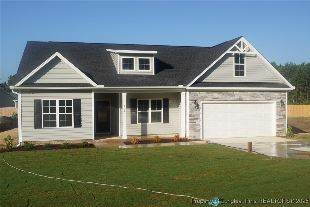 174 Nectar Lane Bunnlevel, NC 28323 - Photo 3 of 41 a front view of a house with a yard