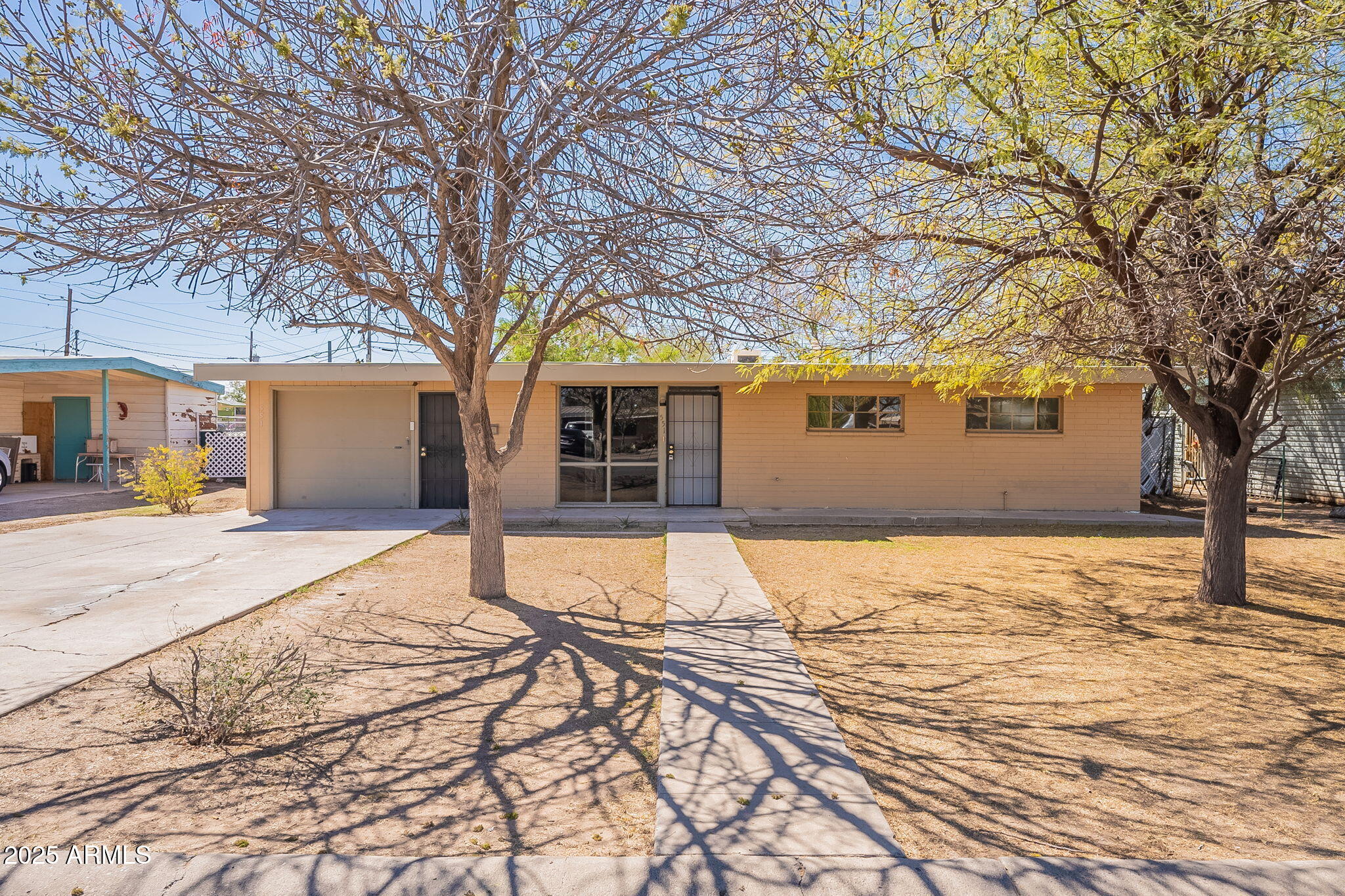 551 West Harding Avenue Coolidge, AZ 85128 - Photo 14 of 52 a house with trees in front of it