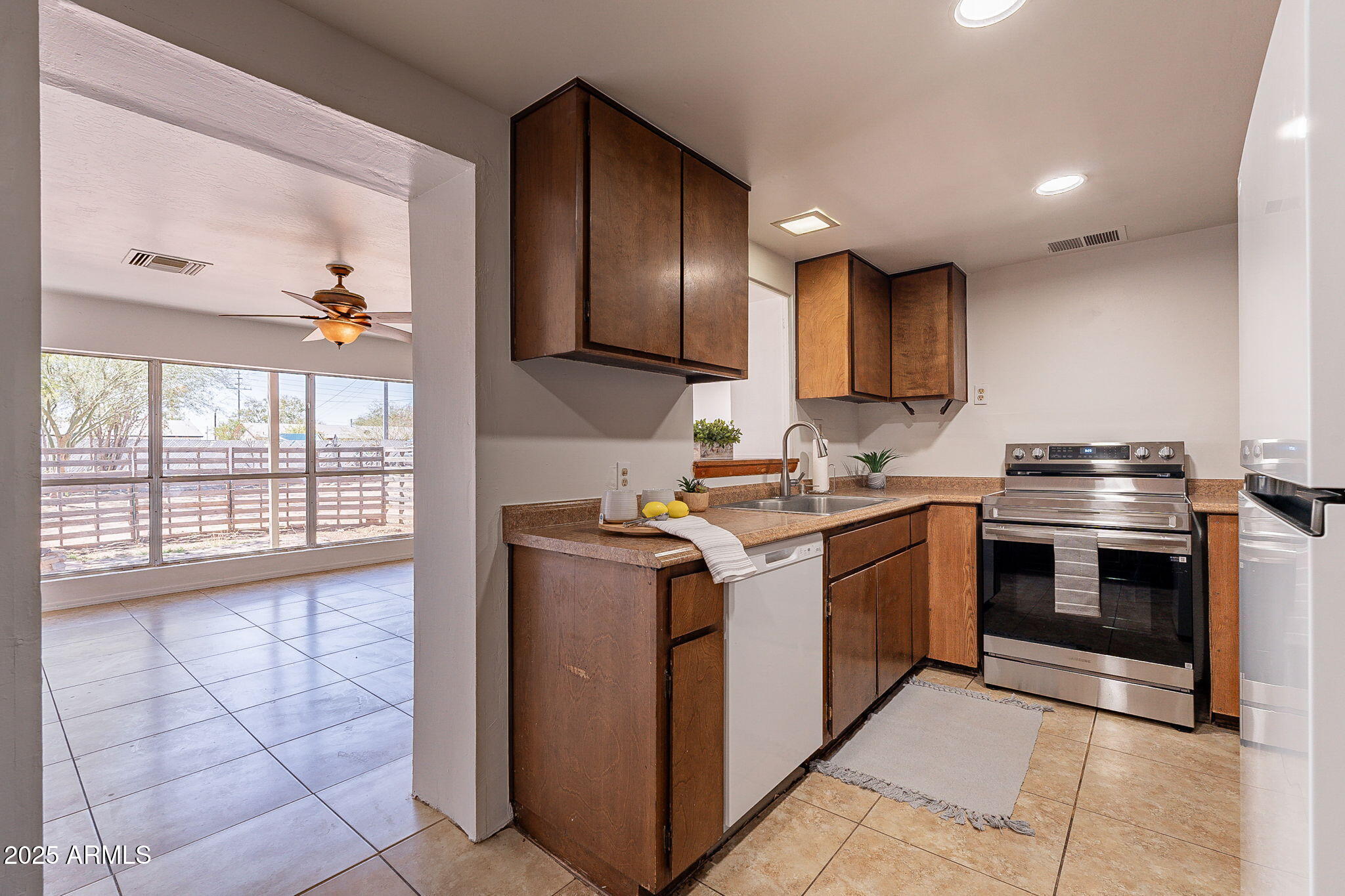 551 West Harding Avenue Coolidge, AZ 85128 - Photo 15 of 52 a kitchen with stainless steel appliances granite countertop a stove and a sink