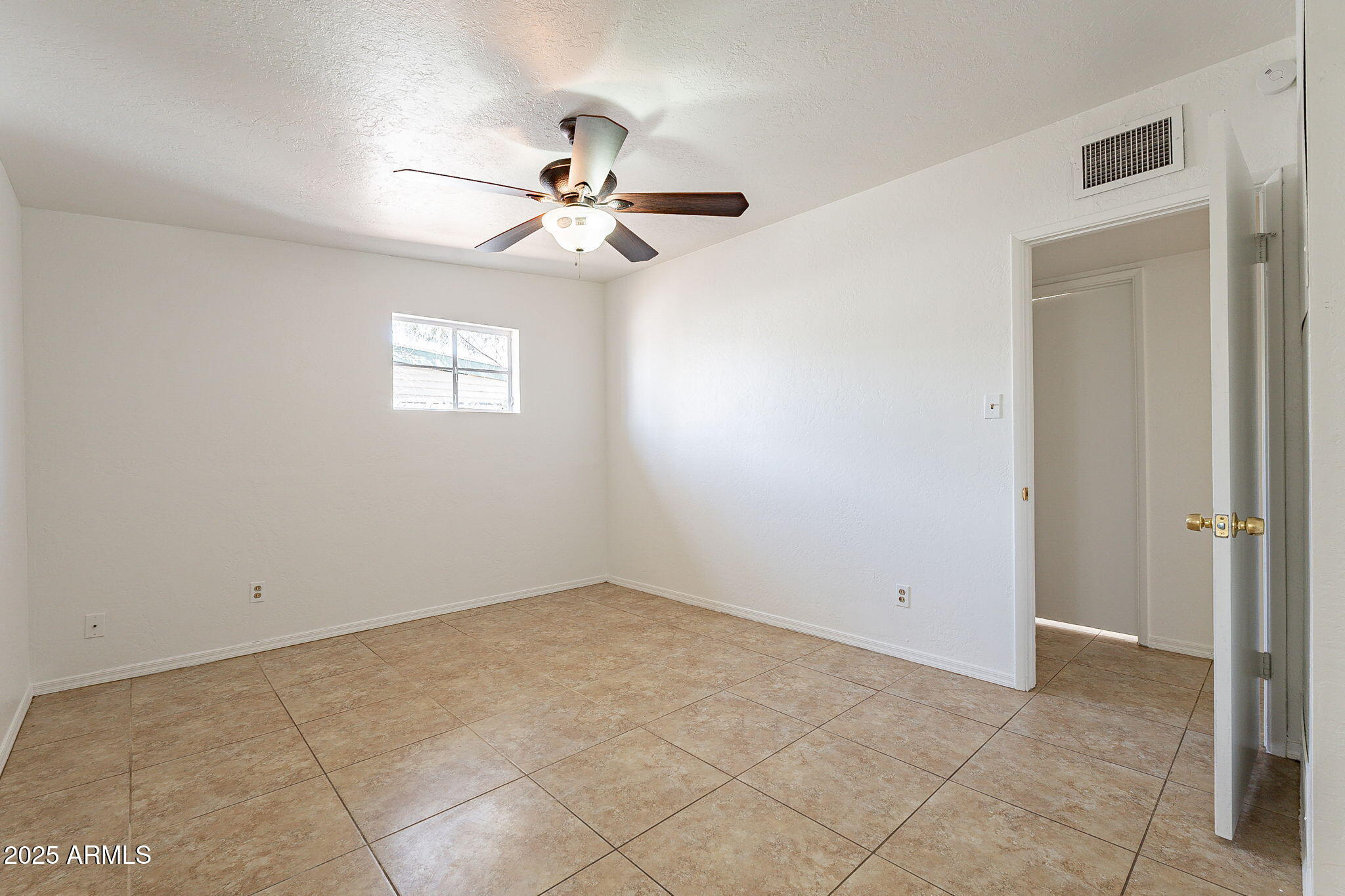 551 West Harding Avenue Coolidge, AZ 85128 - Photo 28 of 52 a view of an empty room with a window