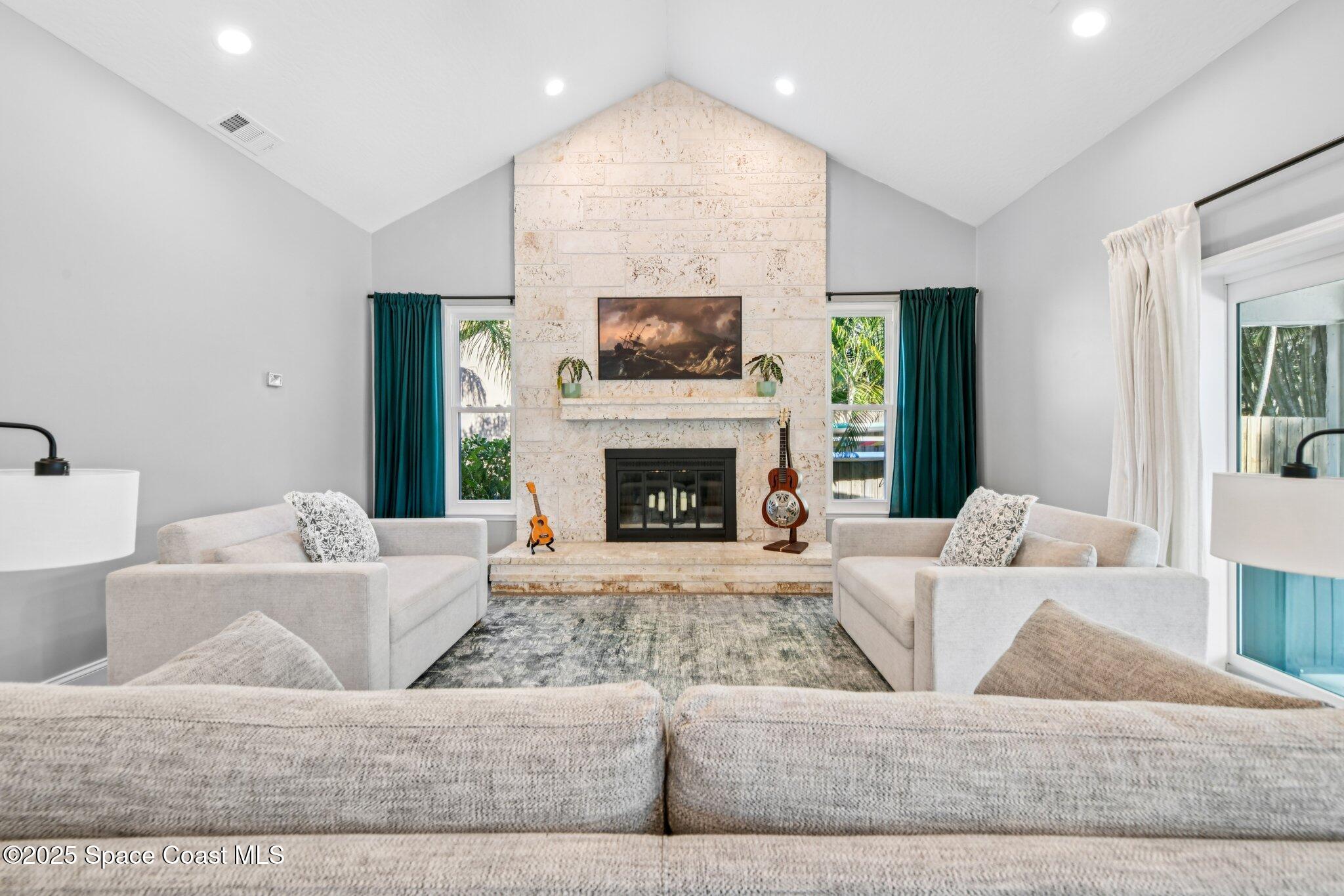 1935 Gates Road Merritt Island, FL 32952 - Photo 5 of 54 a living room with furniture and a fireplace
