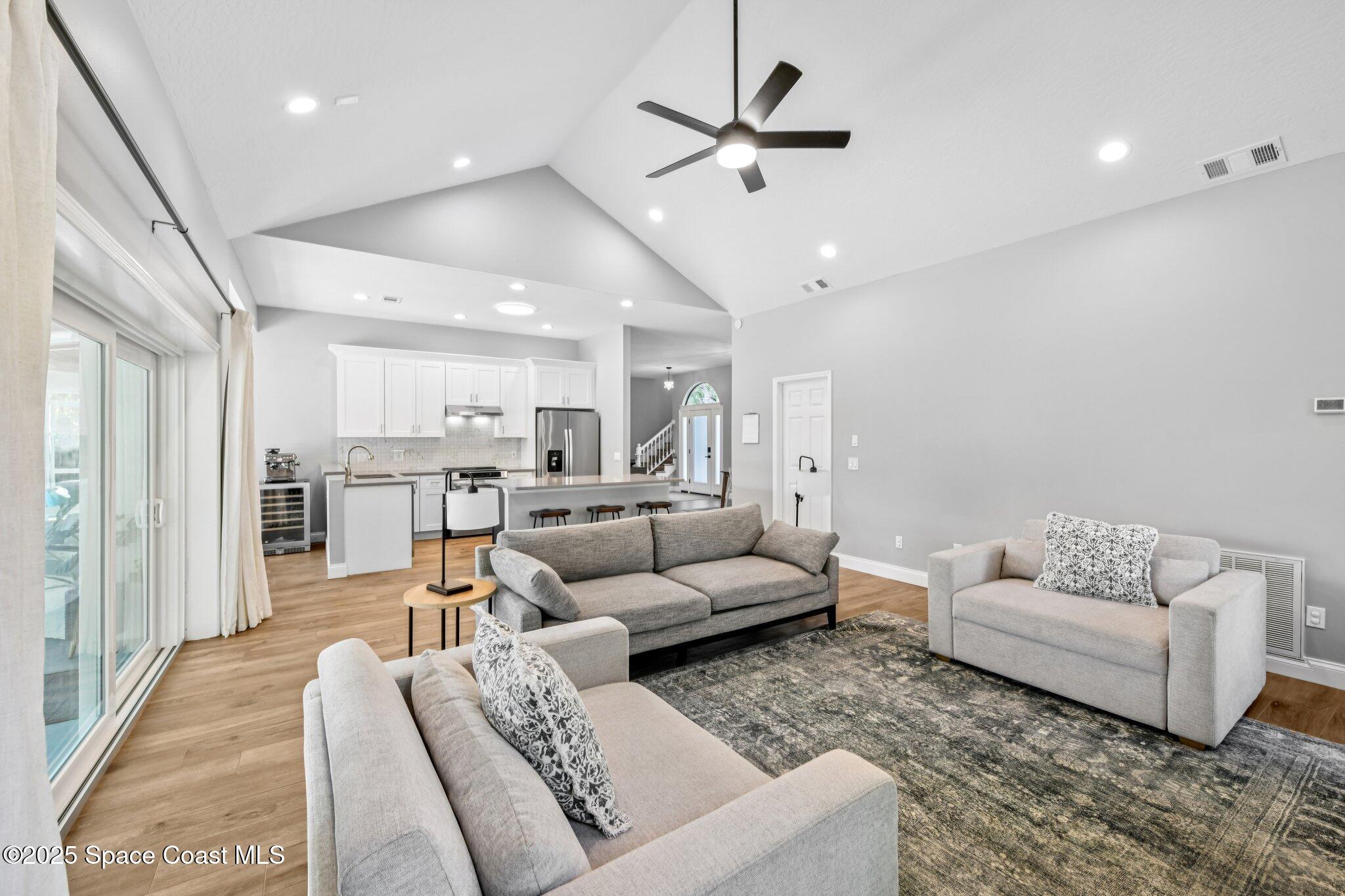 1935 Gates Road Merritt Island, FL 32952 - Photo 6 of 54 a living room with furniture and kitchen view