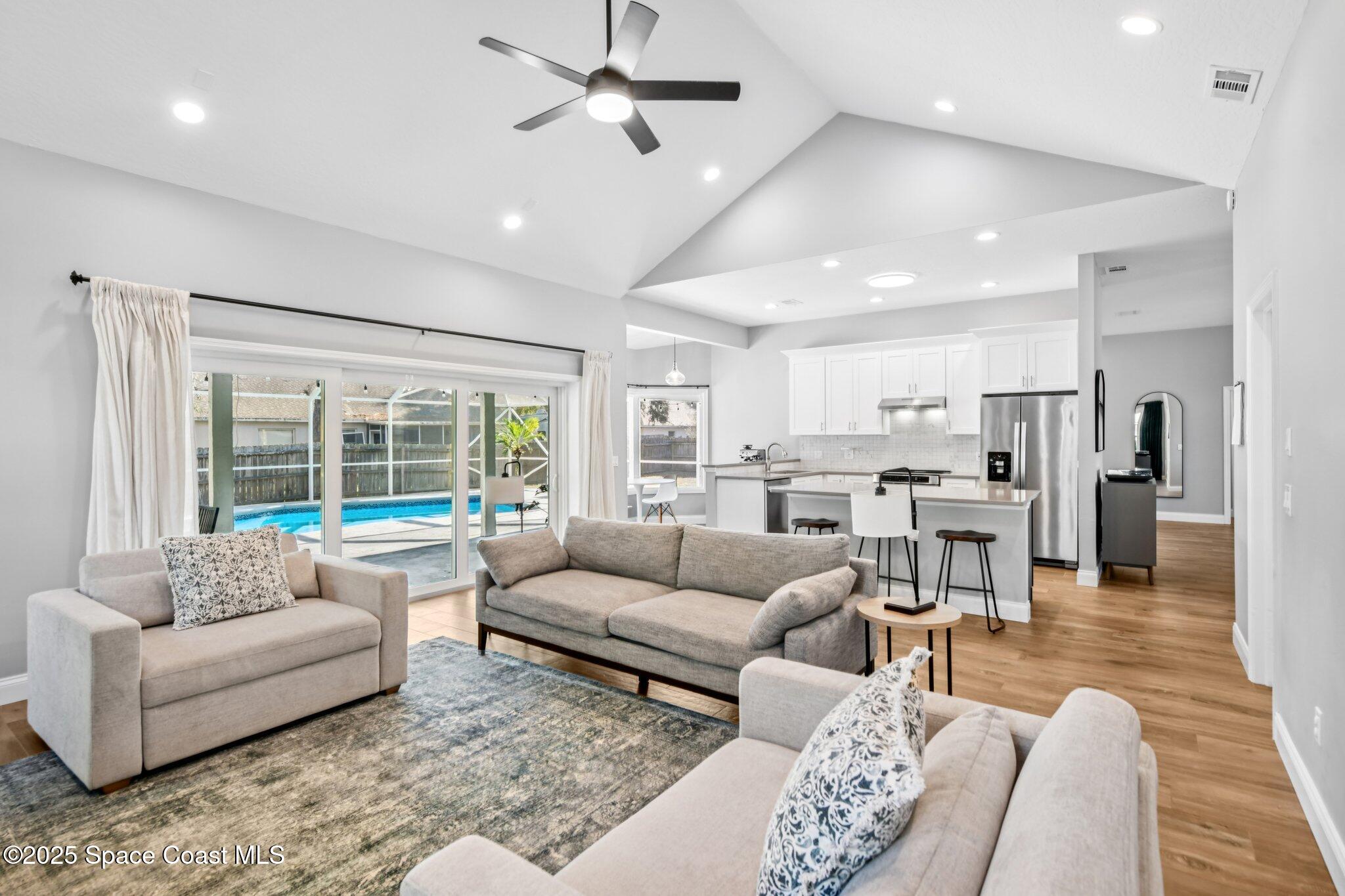1935 Gates Road Merritt Island, FL 32952 - Photo 7 of 54 a living room with furniture and a large window