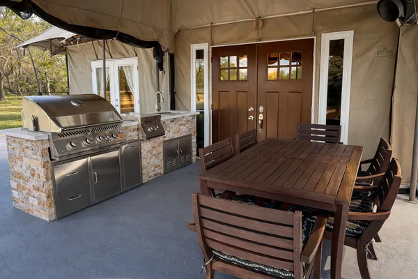 a kitchen with a stove and a refrigerator