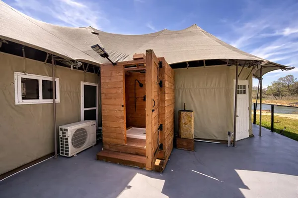 a view of backyard with cabin