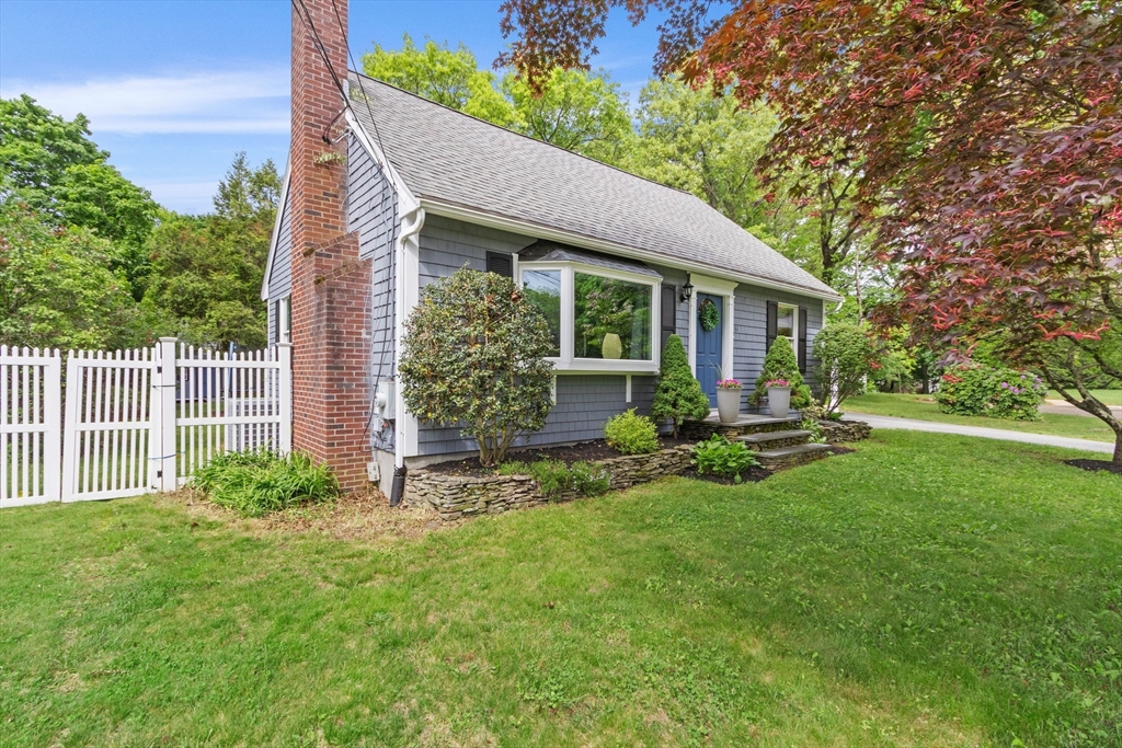 61 Pine Ridge Drive Franklin, MA 02038 - Photo 3 of 41 a view of a house with backyard sitting area and garden