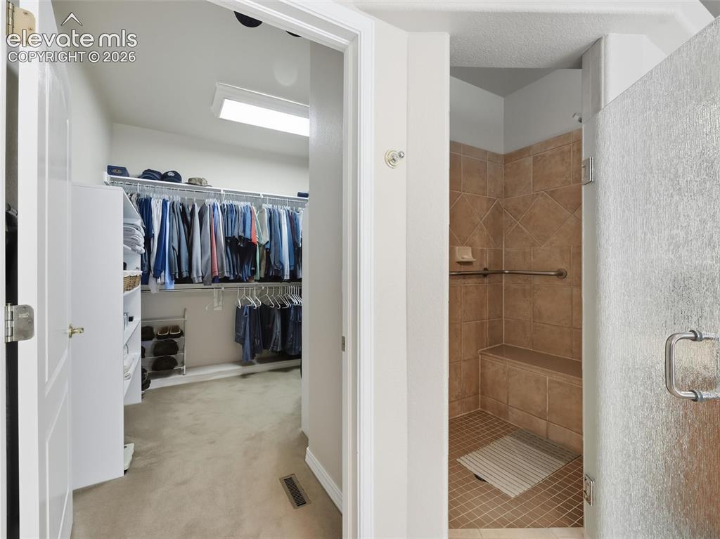 12855 Murphy Road Elbert, CO 80106 - Photo 17 of 50 a view of a walk in closet and bathroom