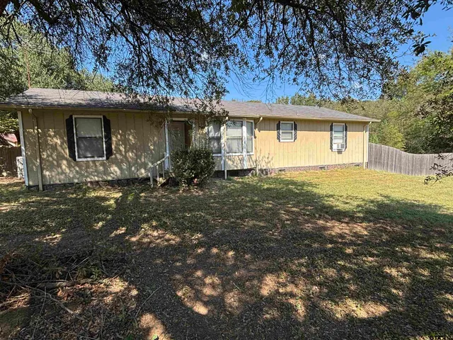 a front view of a house with yard