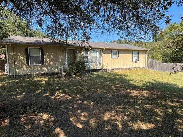 a front view of a house with yard