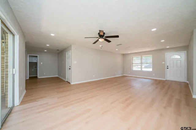 a view of an empty room with a window