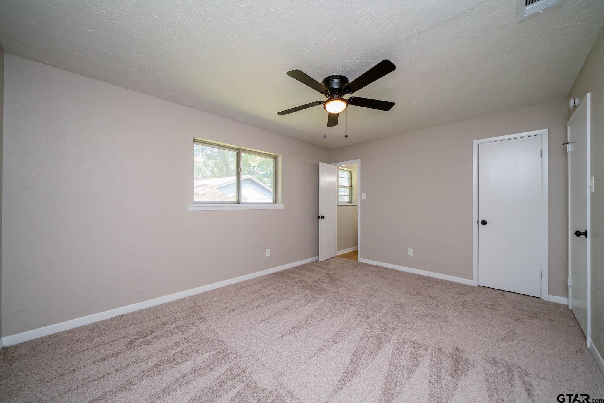 1411 Sapphire Street Longview, TX 75602 - Photo 23 of 38 a view of an empty room with a window