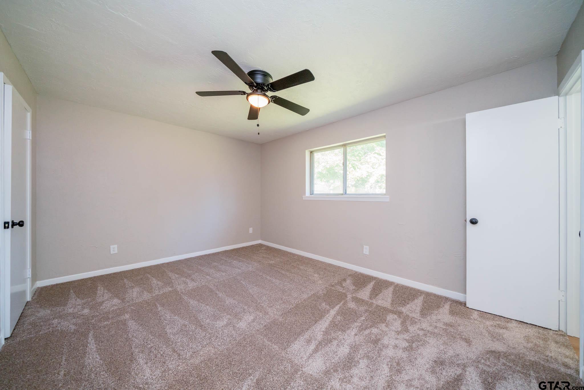 1411 Sapphire Street Longview, TX 75602 - Photo 24 of 38 a view of an empty room with a window