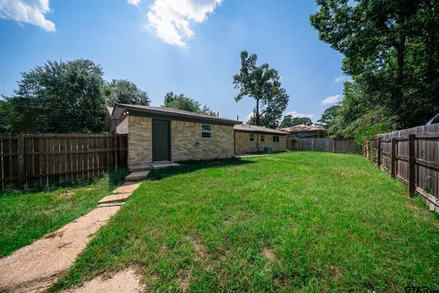 a view of a backyard with a garden