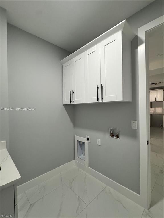 3414 4th Street Southwest Lehigh Acres, FL 33976 - Photo 13 of 28 a view of cabinets and wooden floor