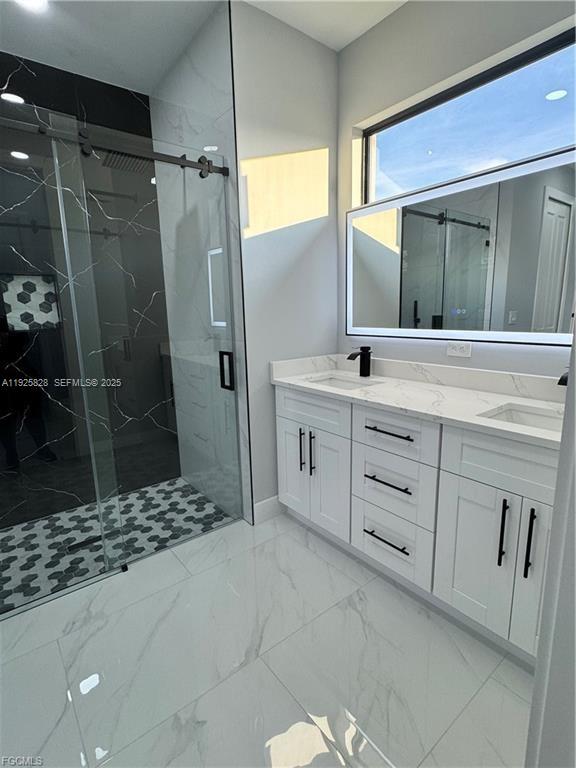 3414 4th Street Southwest Lehigh Acres, FL 33976 - Photo 16 of 28 a bathroom with a shower sink and mirror