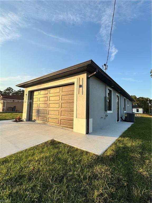 3414 4th Street Southwest Lehigh Acres, FL 33976 - Photo 2 of 28 a house view with a backyard space