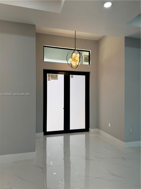 3414 4th Street Southwest Lehigh Acres, FL 33976 - Photo 6 of 28 a view of an empty room with a window